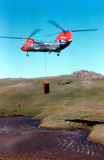 Adak, Search & Rescue retrieving survival barrel from lake near Bay of Islands - Aug. 1974  Photo by Michael Hein