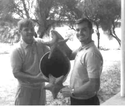 Ens. Myers, Ens. Bourgoyne (1969).  Attempted to catch some rock lobsters, but they were too fast.  Starfish were more my speed.