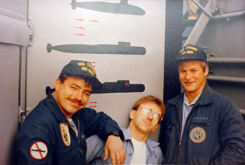 Sean Richardson, Dennis and Bob posing by the USS Kinkaids TASS van